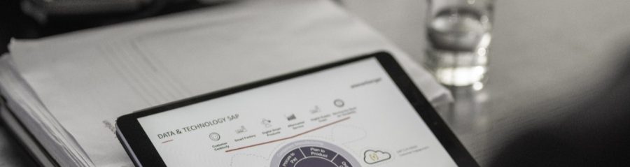 Close-up of manager working on tablet computer screen, CRM, SAP