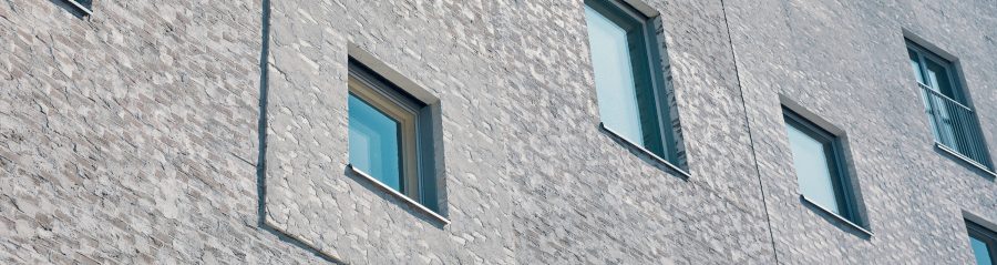 Multistore building with special joint, Supewhite and Tummapellava Retro facing bricks