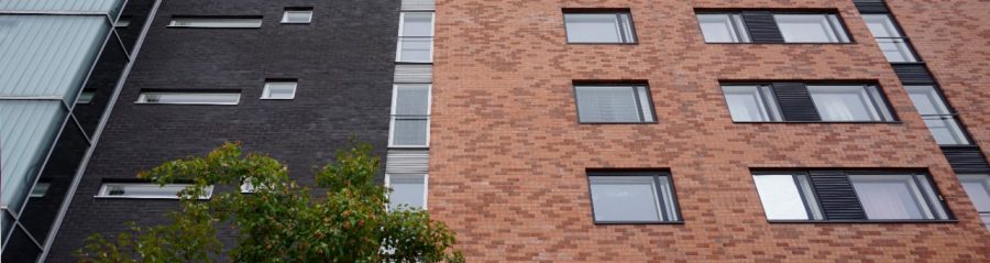 Aparment building Agronomintie Latokaski black facade with red brick mix