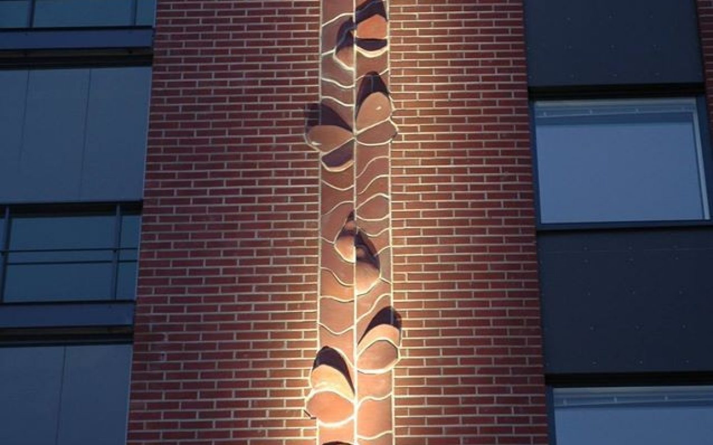 Brick relief "moth's fly" integrated into brick facade  Vuores Tampere