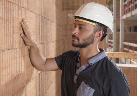 Building professional touching brick block wall