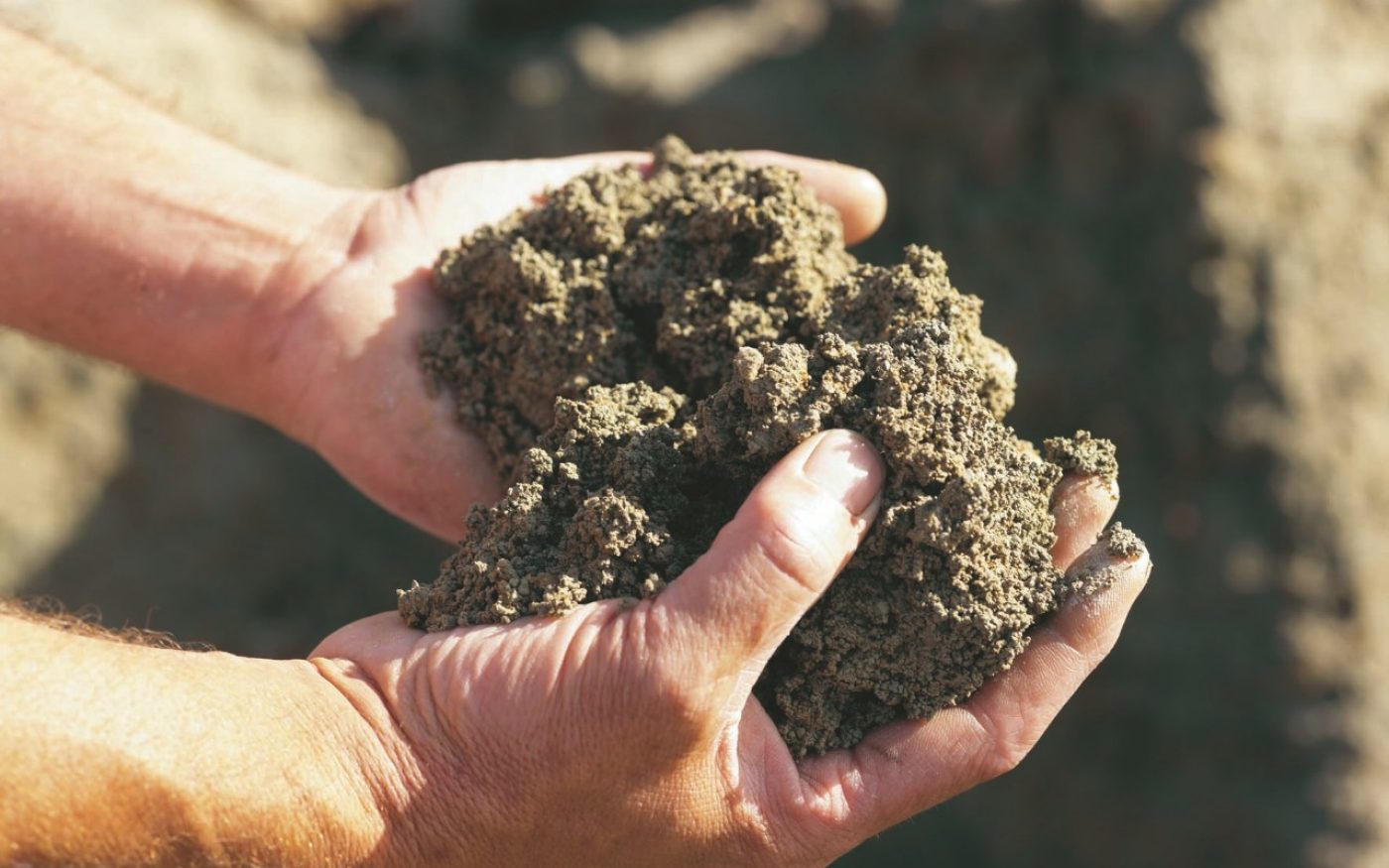 Photography of hands holding clay