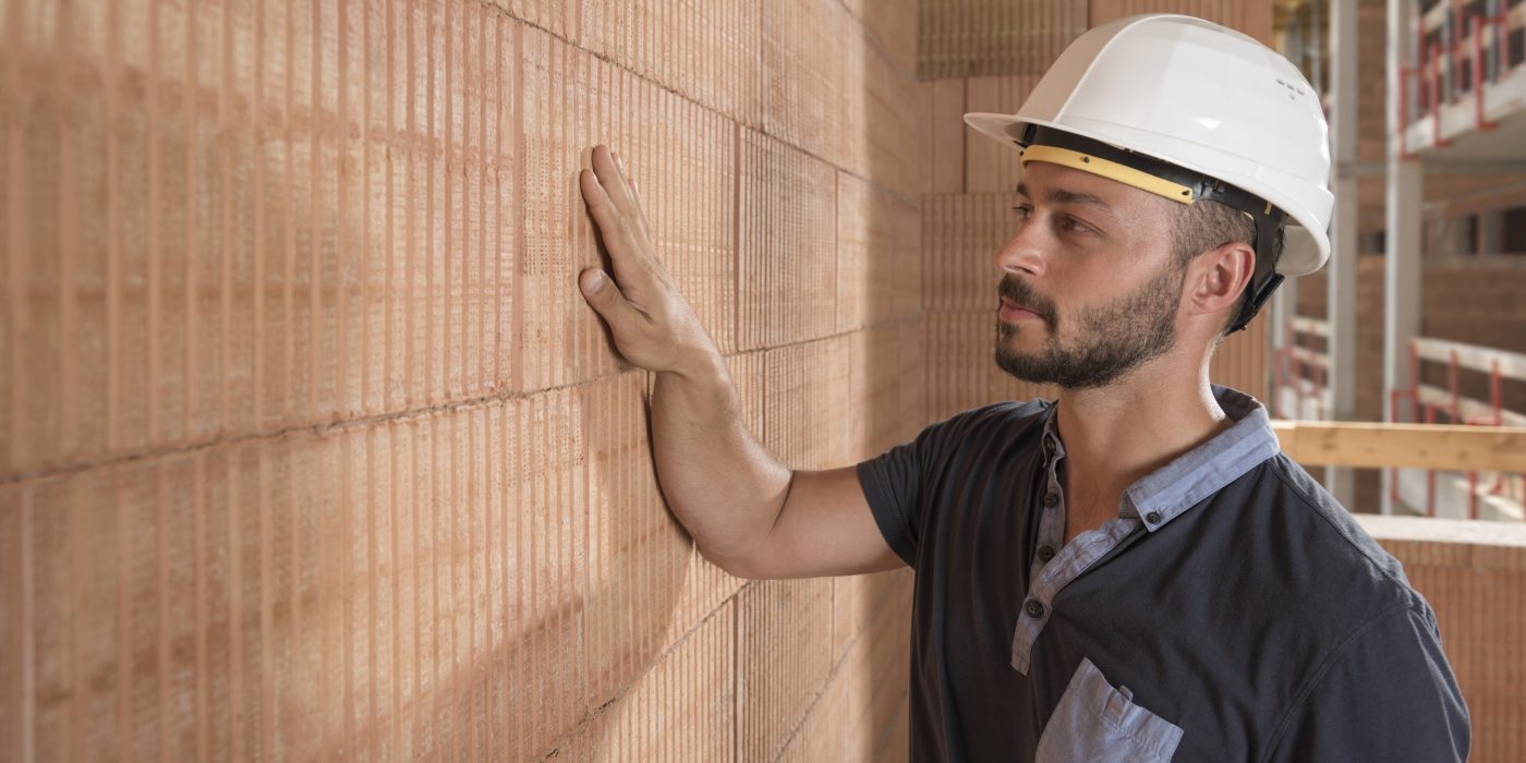 Building professional touching brick block wall