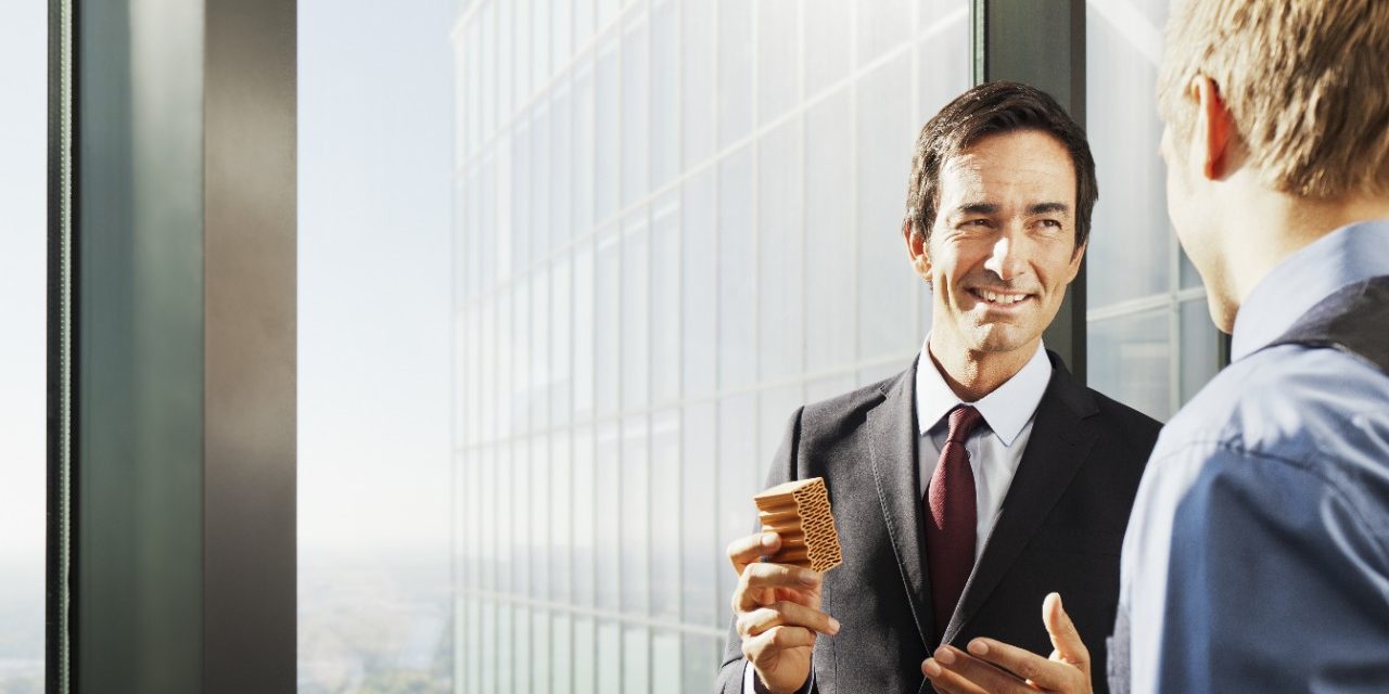 Business people inside high-rise building with a stunning view